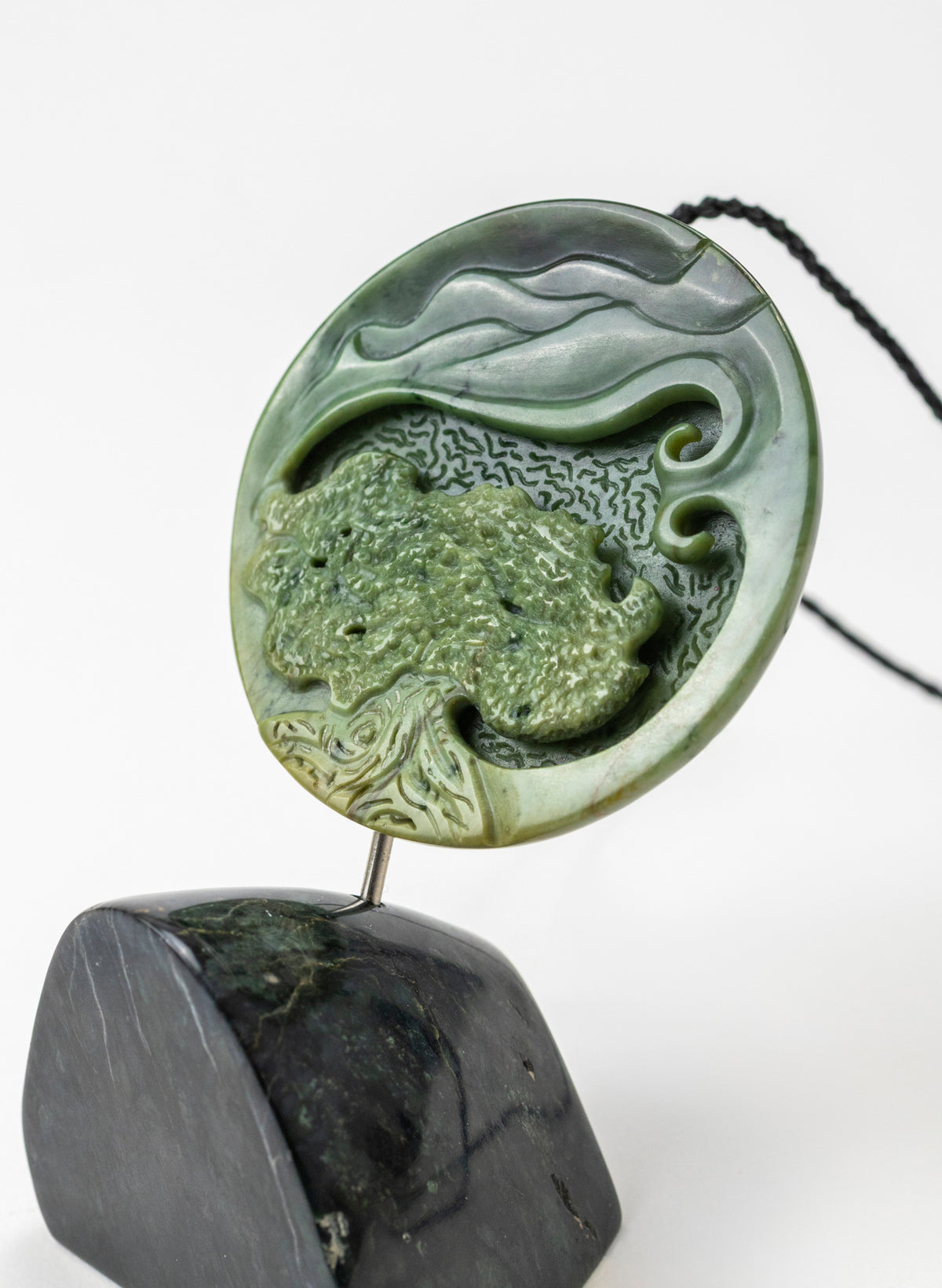 Carved Pounamu Porohita Sculpture on a Stand
