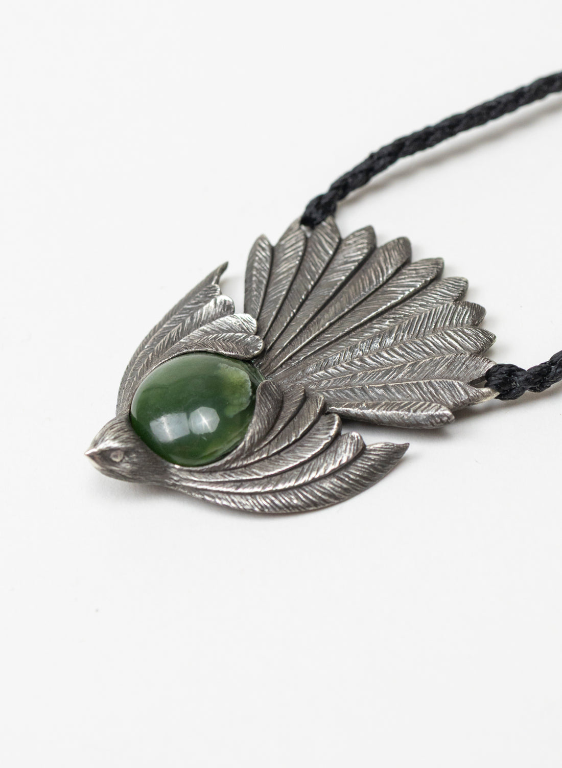 Sterling Silver Piwakawaka Pendant with a Pounamu Insert