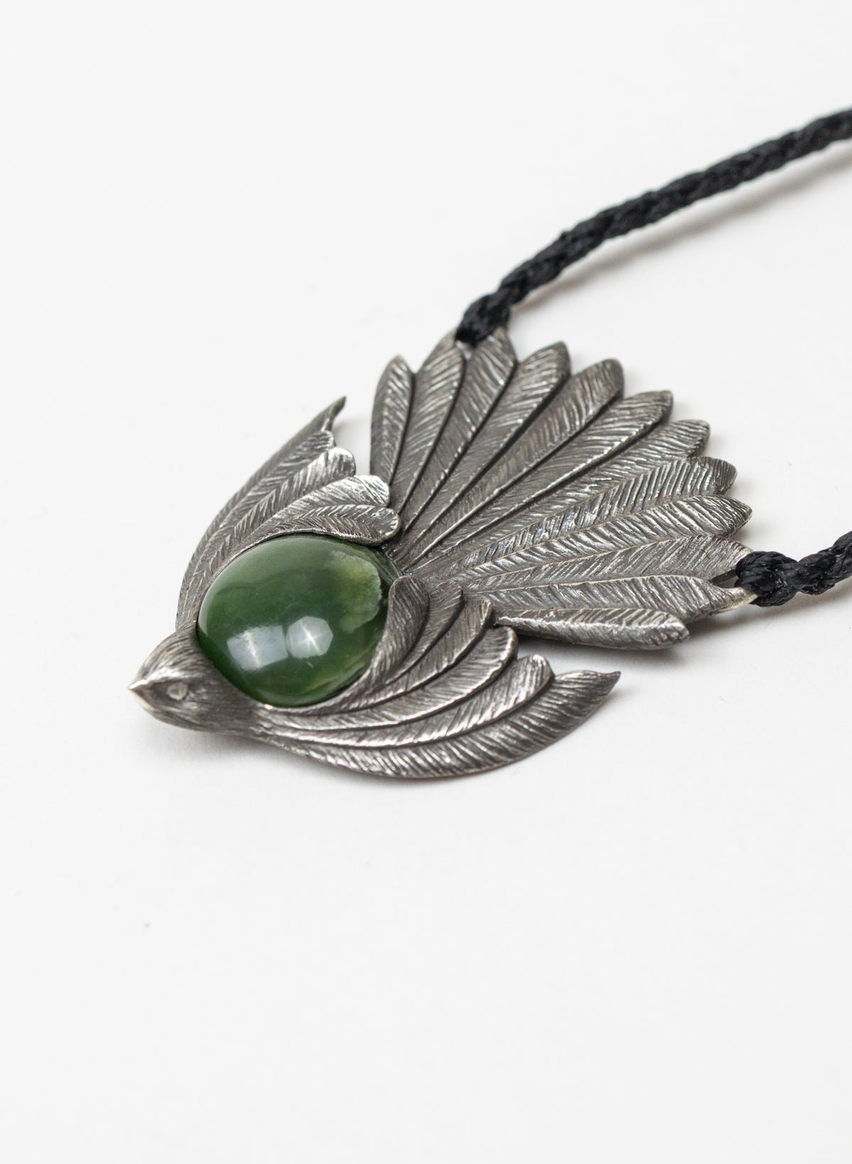 Sterling Silver Piwakawaka Pendant with a Pounamu Insert