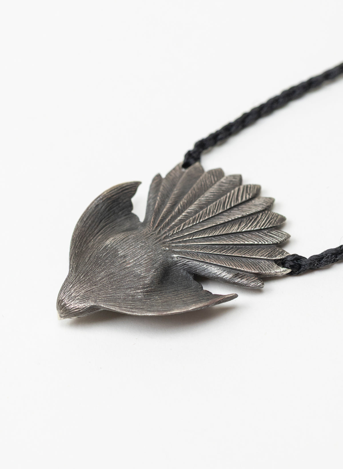 Sterling Silver Piwakawaka Pendant with a Pounamu Insert