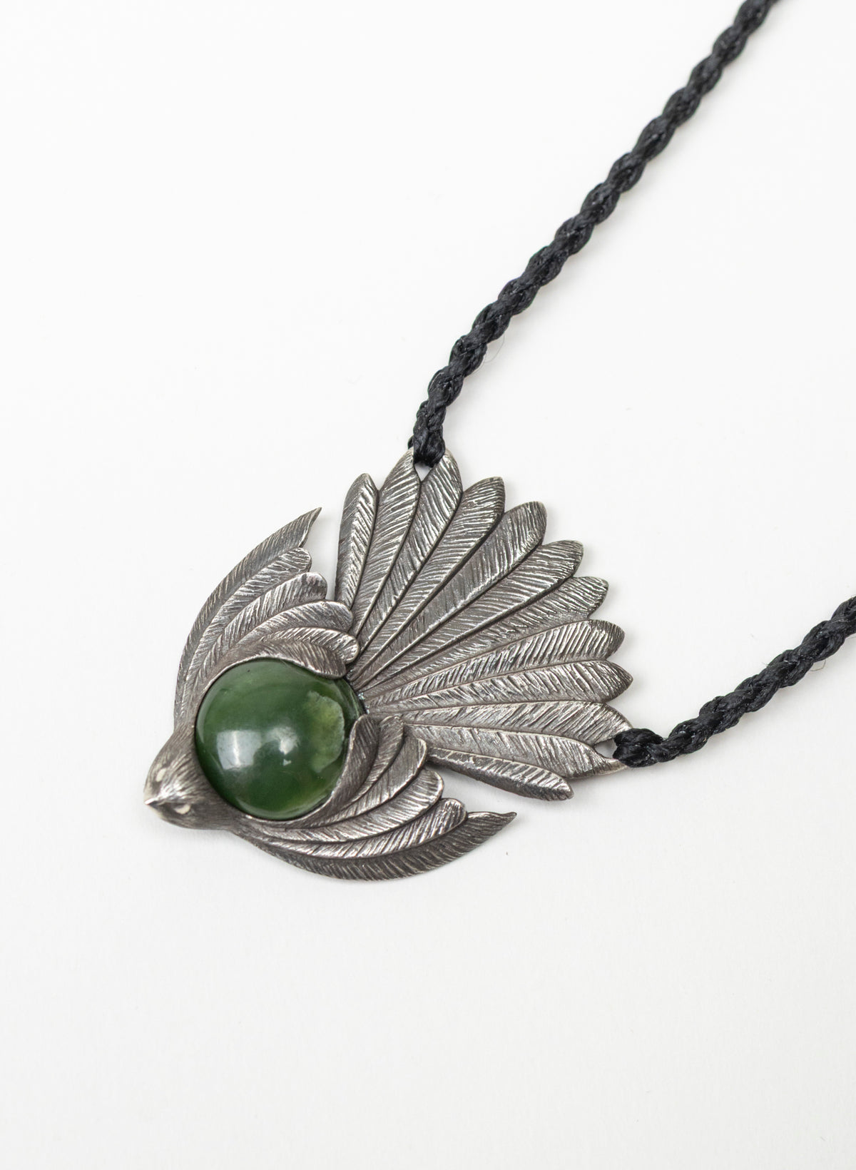 Sterling Silver Piwakawaka Pendant with a Pounamu Insert