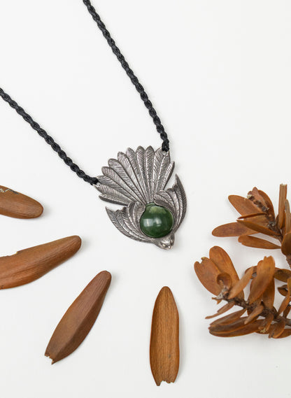 Sterling Silver Piwakawaka Pendant with a Pounamu Insert