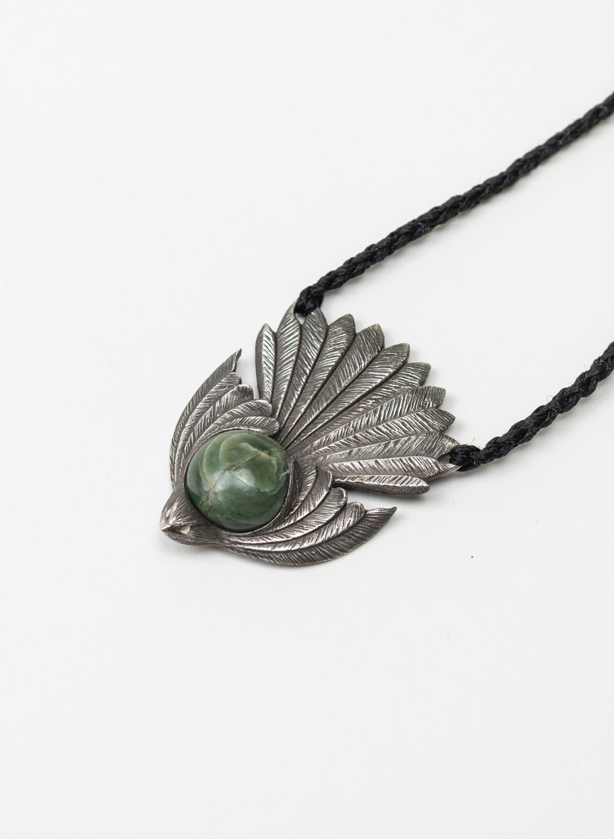 Sterling Silver Piwakawaka Pendant with a Pounamu Insert