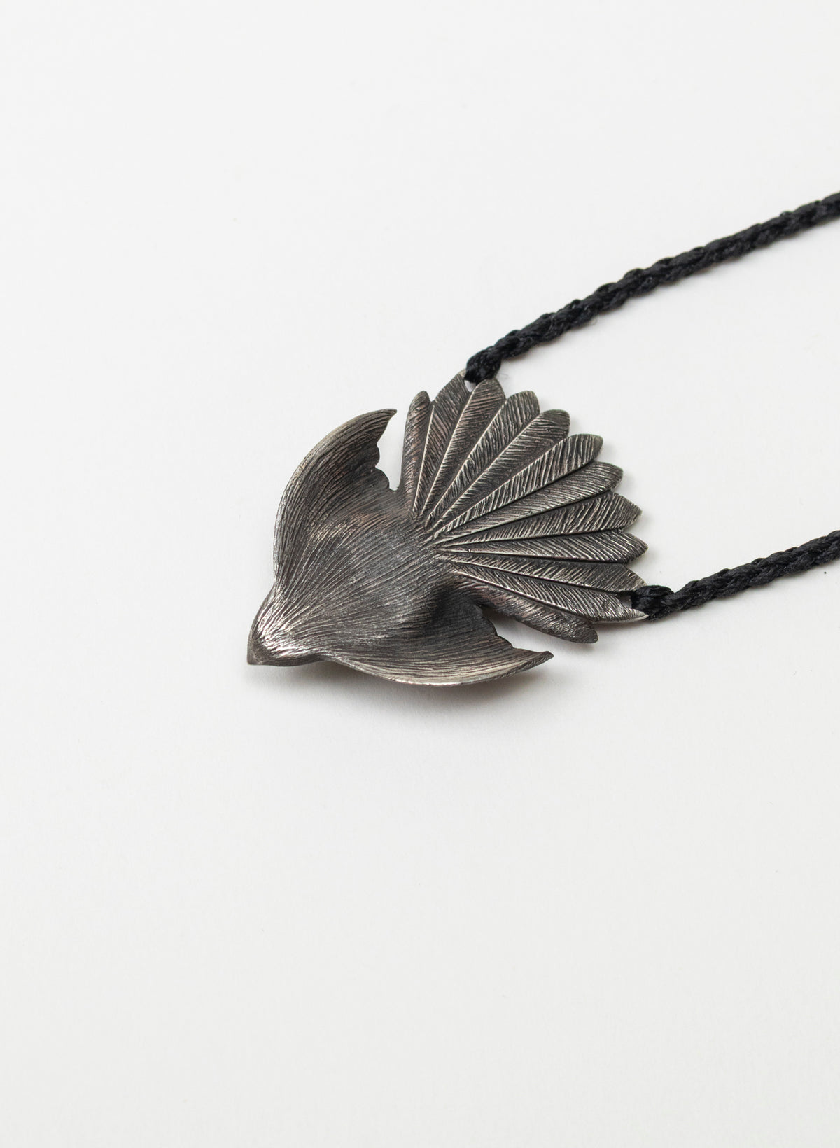 Sterling Silver Piwakawaka Pendant with a Pounamu Insert