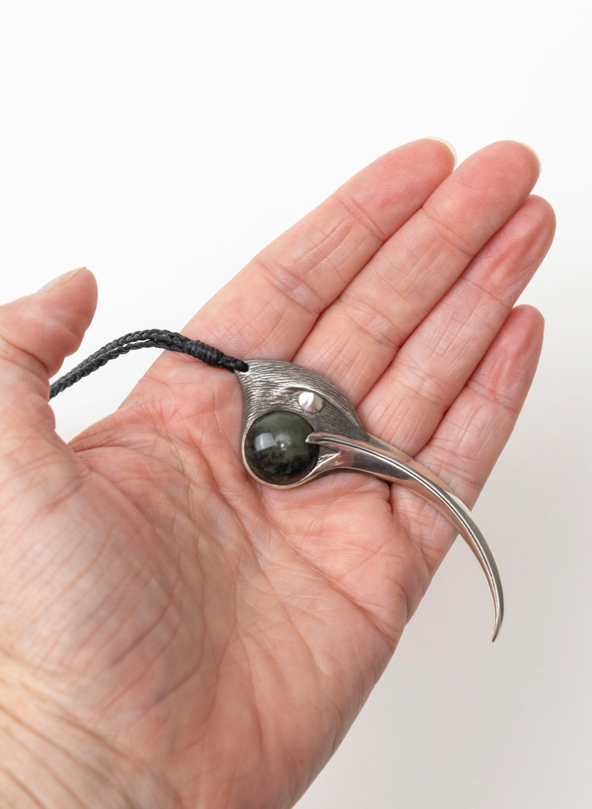 Sterling Silver Female Huia Pendant with a Pounamu Insert