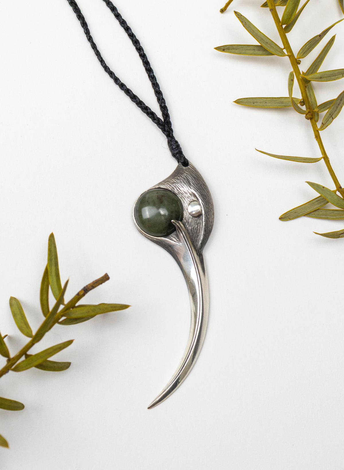 Sterling Silver Female Huia Pendant with a Pounamu Insert