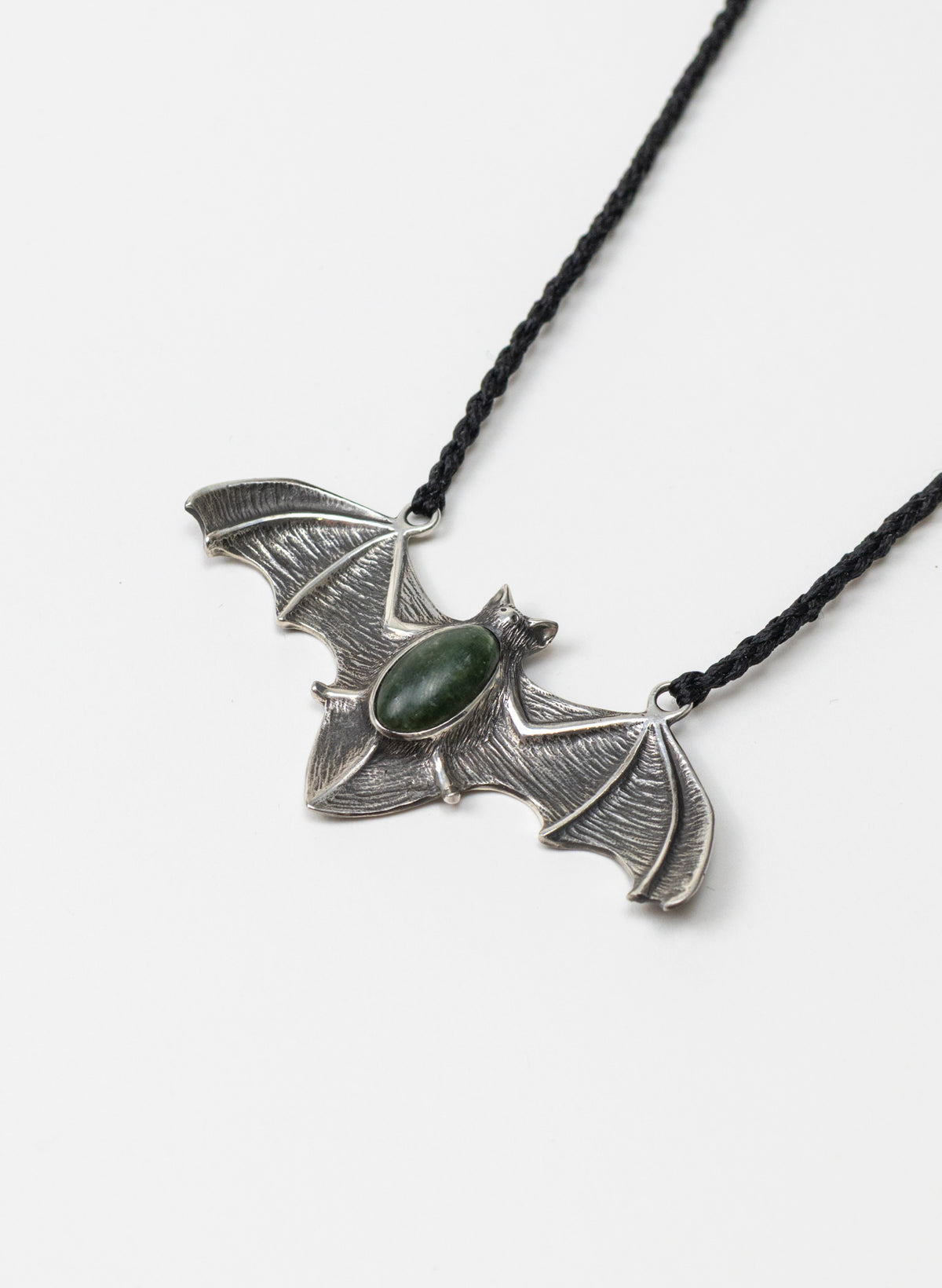 Sterling Silver Pekapeka Pendant with a Pounamu Insert