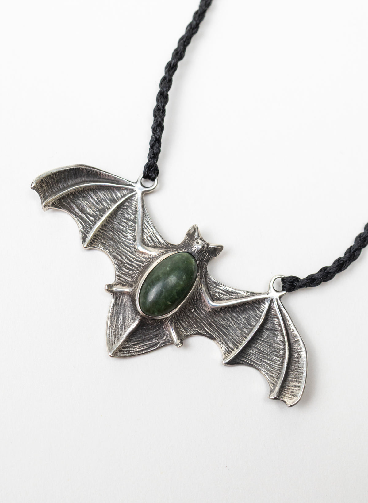 Sterling Silver Pekapeka Pendant with a Pounamu Insert