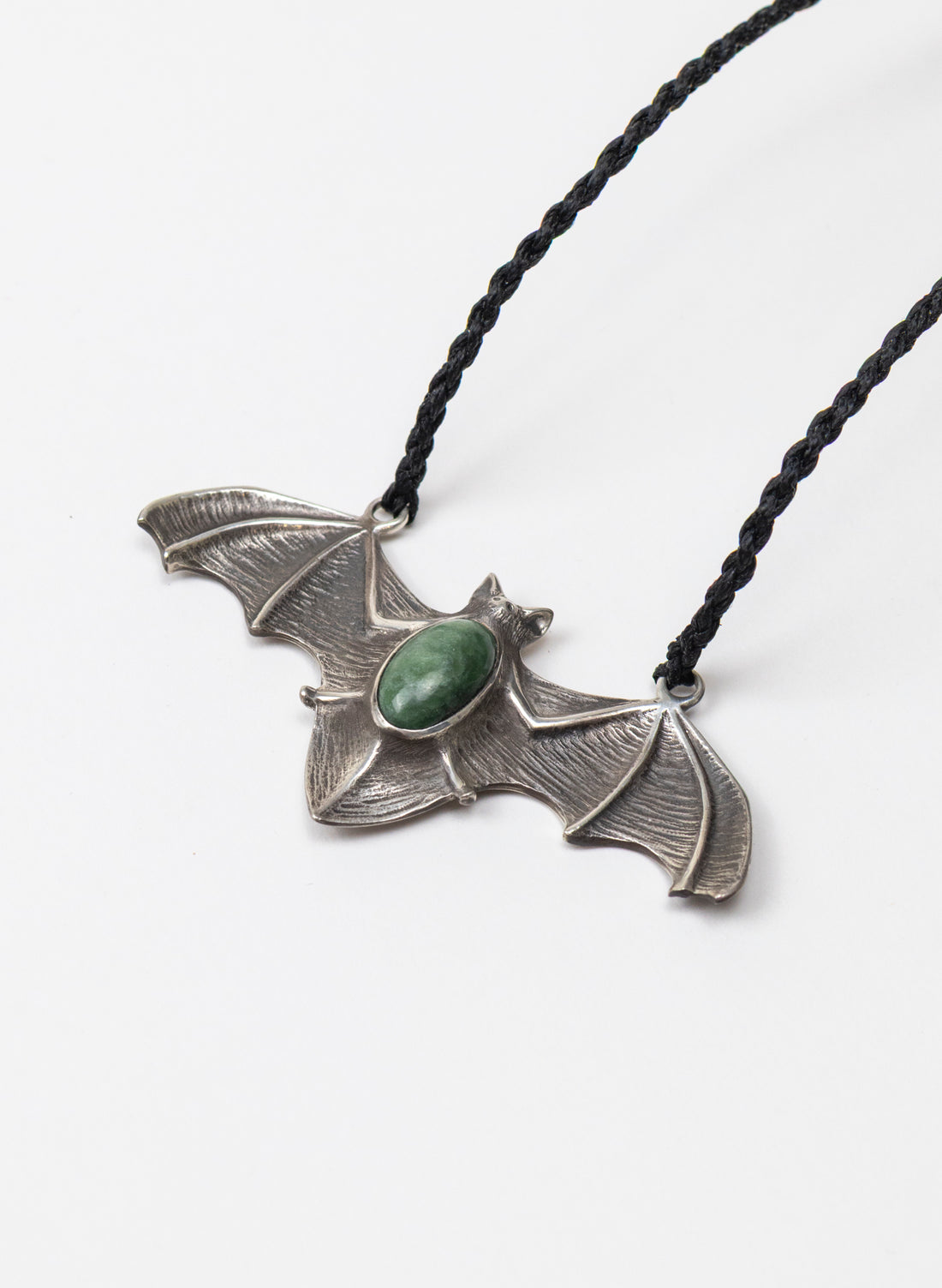 Sterling Silver Pekapeka Pendant with a Pounamu Insert