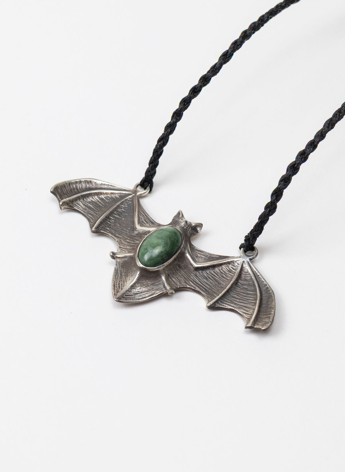 Sterling Silver Pekapeka Pendant with a Pounamu Insert