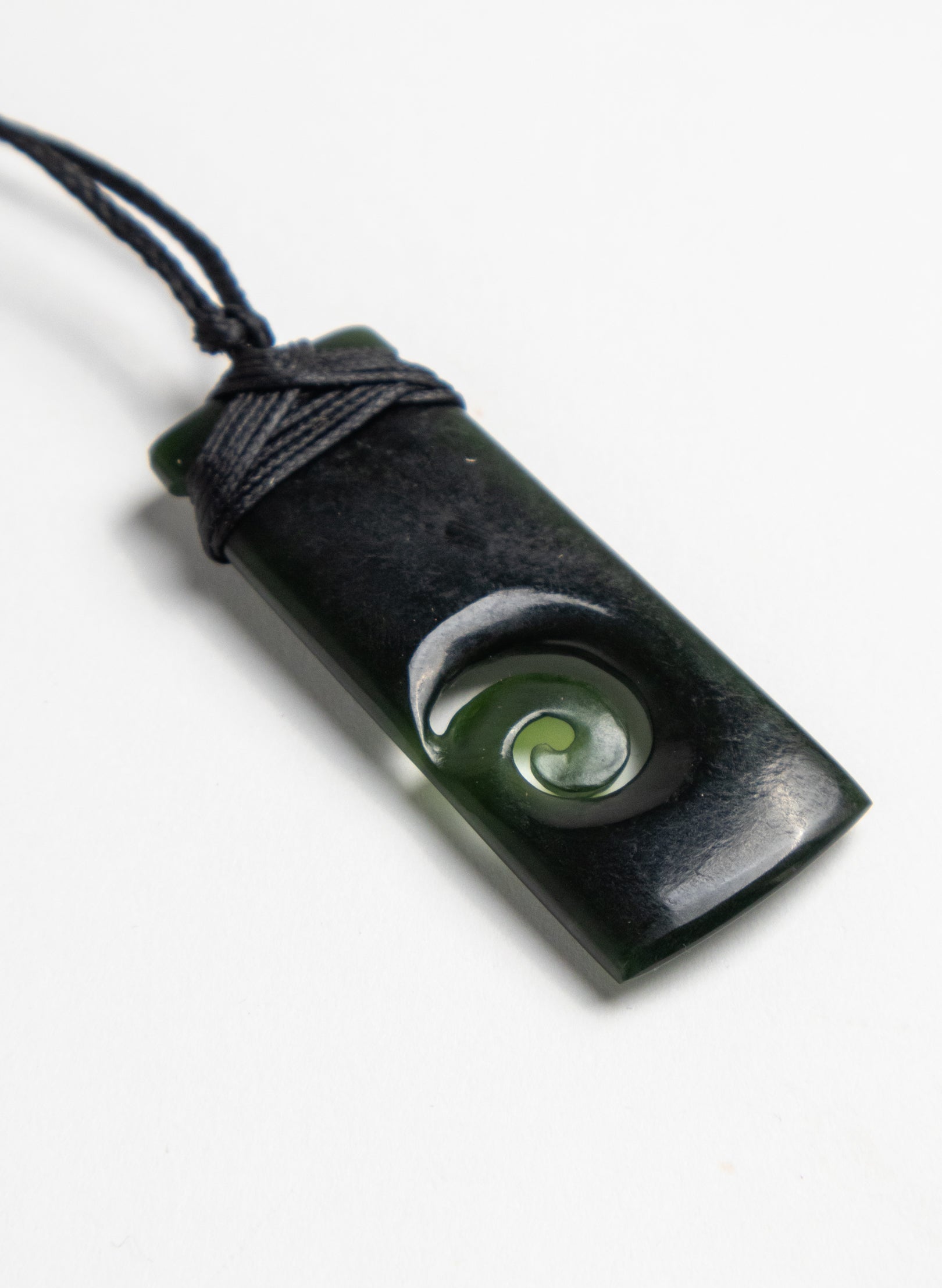 Bound Pounamu Toki with Koru