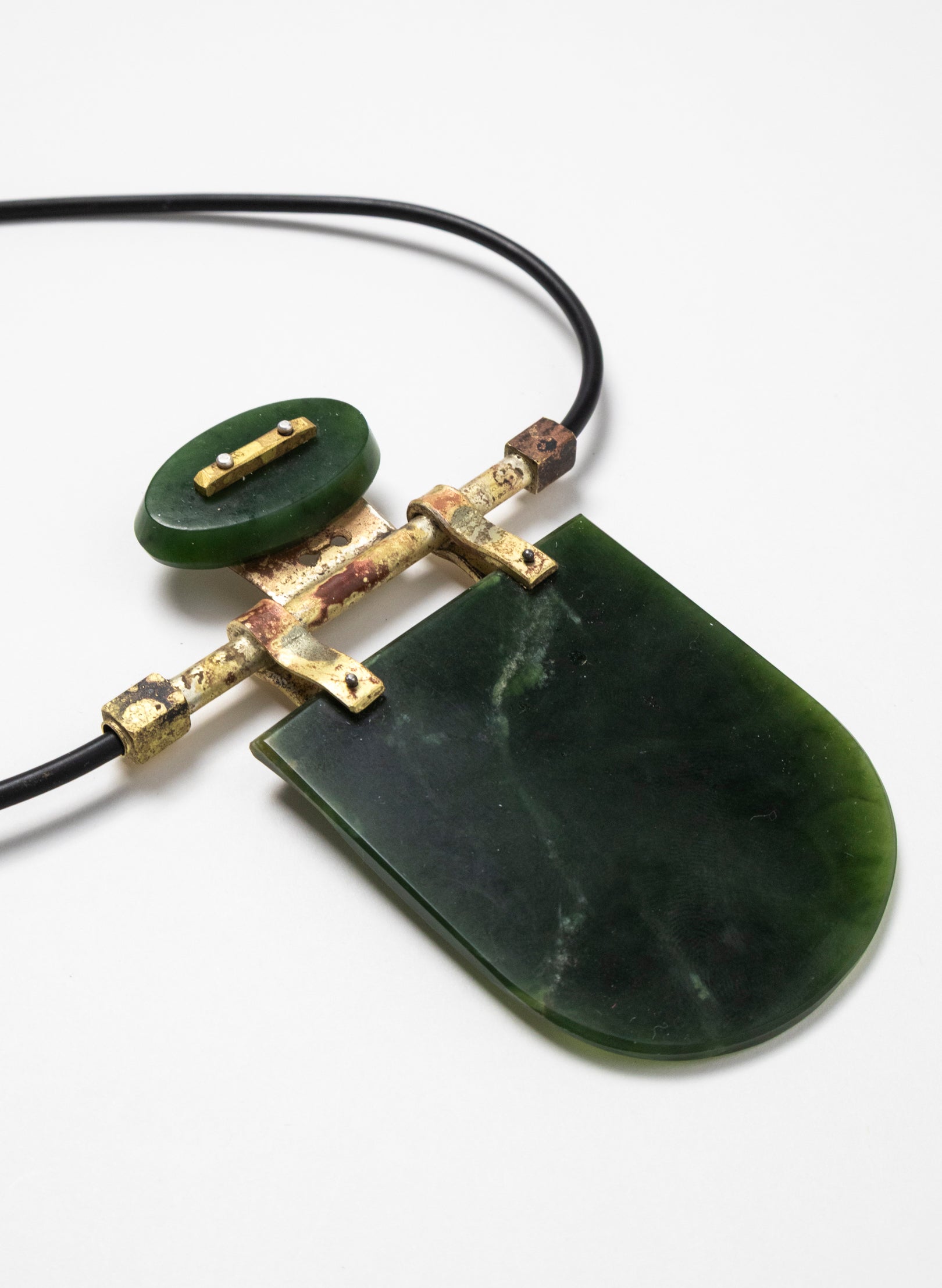 Brass, Rubber and NZ Pounamu Necklace with Stand