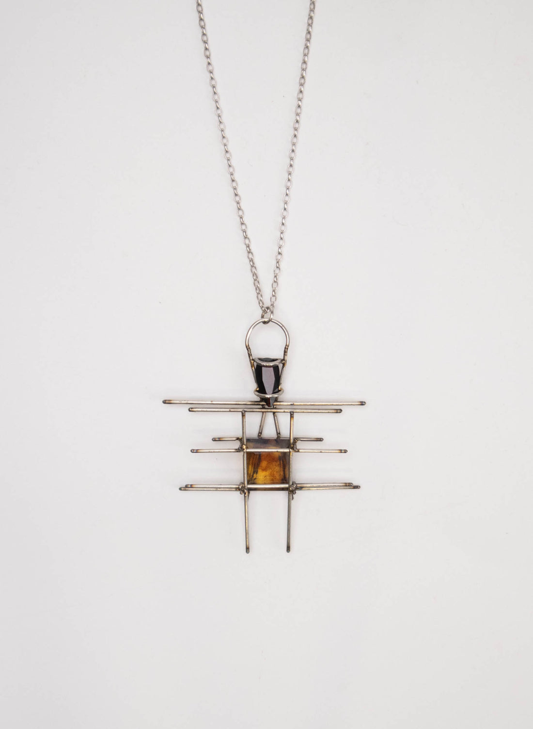 New Zealand Amber, Garnet and Titanium Pendant