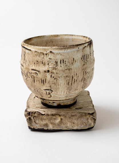 White Ceramic Cup on Pedestal