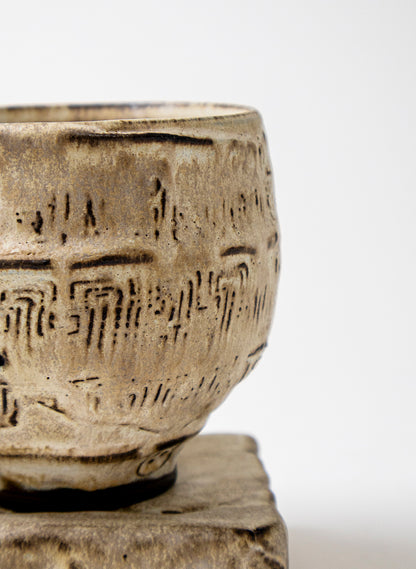 White Ceramic Cup on Pedestal