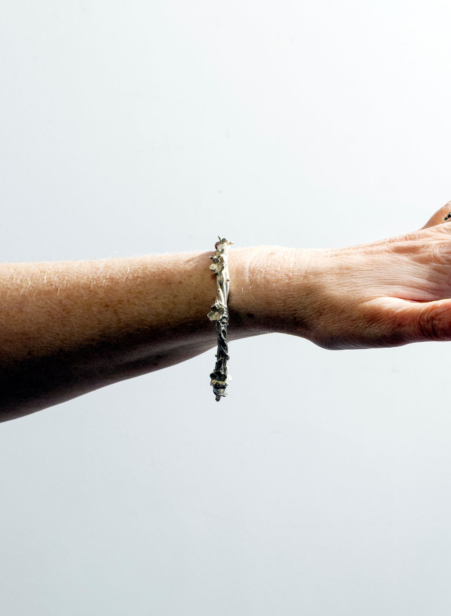 Entwined Flower and Leaf Bangle - Silver