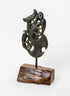 Manaia Pounamu on a Stand, full dark green carving mounted on a black rod and wooden base