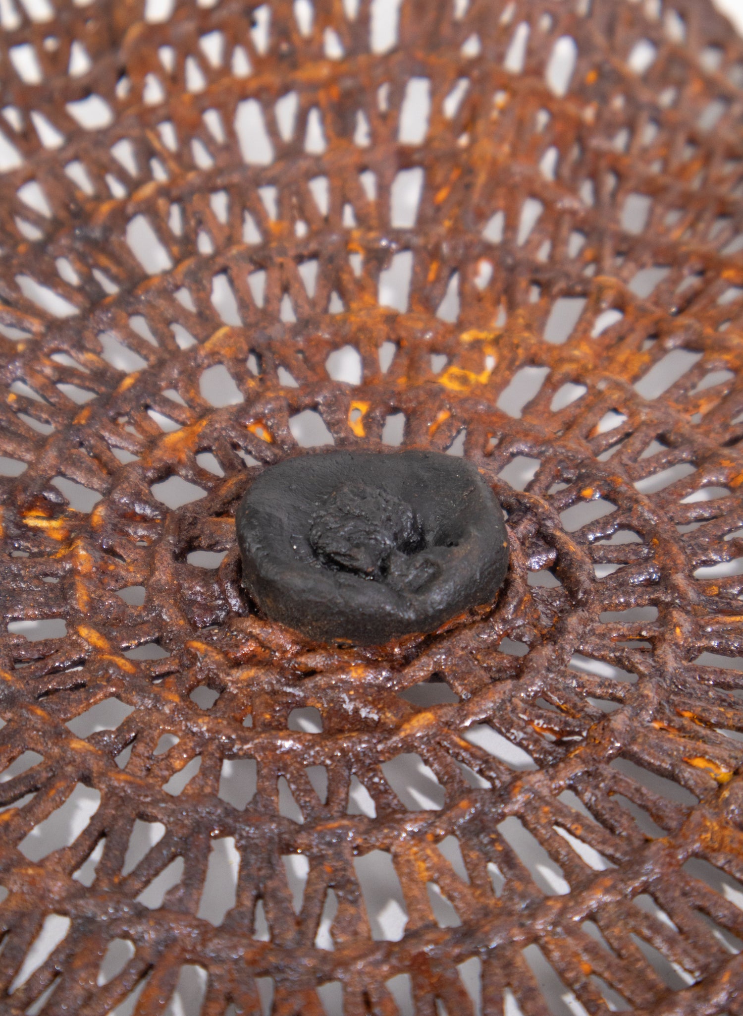 Woven Reed, Iron Pigment and Ceramic Tide Catcher