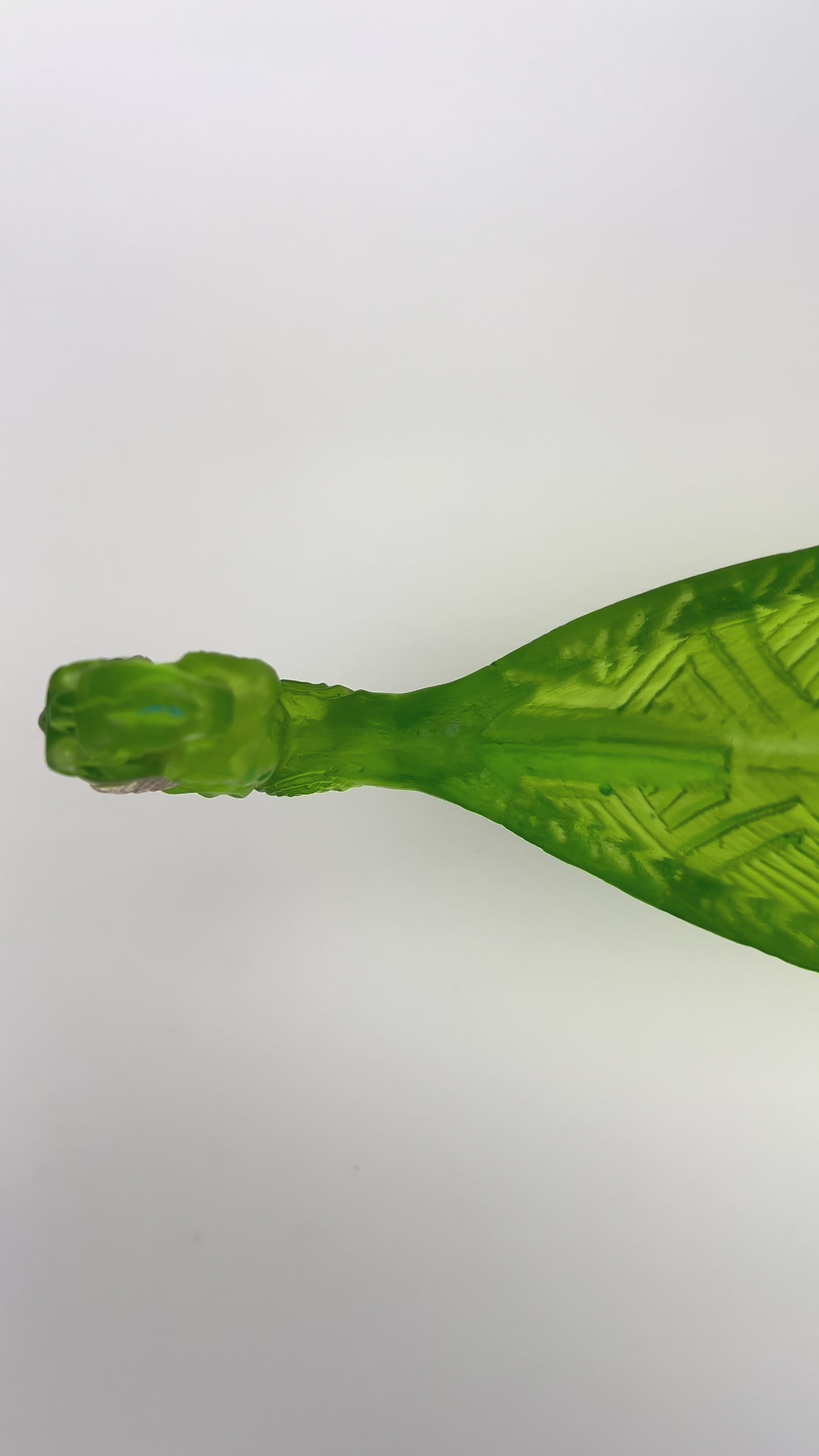 Green Manaia with standing Tangaroas