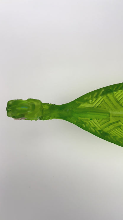 Green Manaia with standing Tangaroas