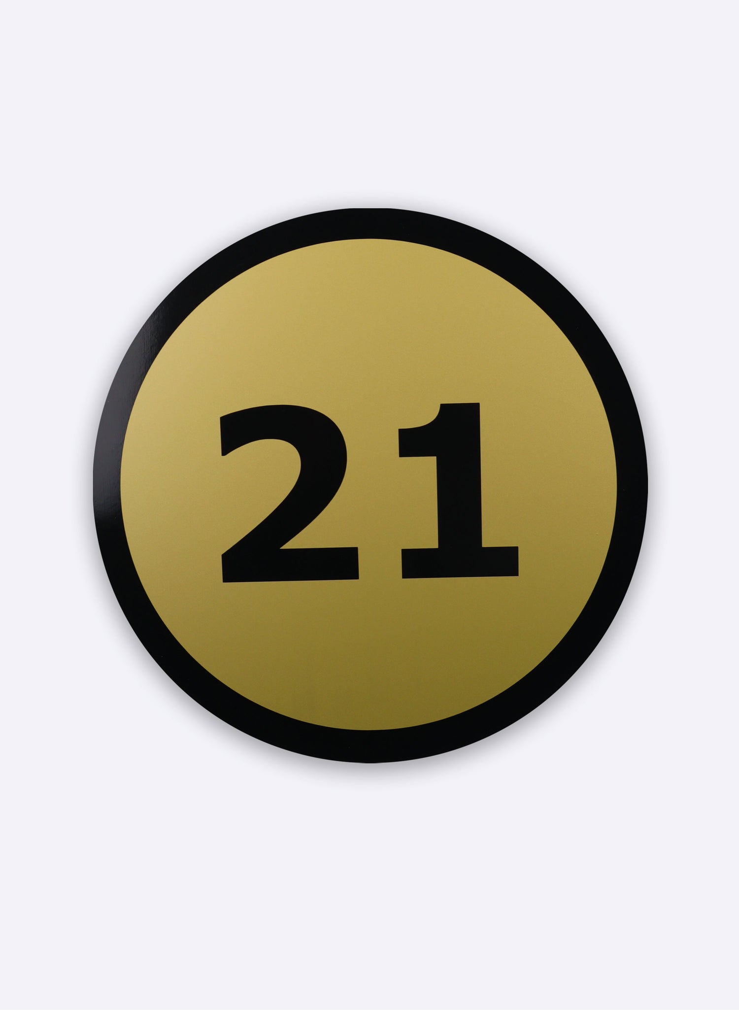 21 Round Black on Gold Sign
