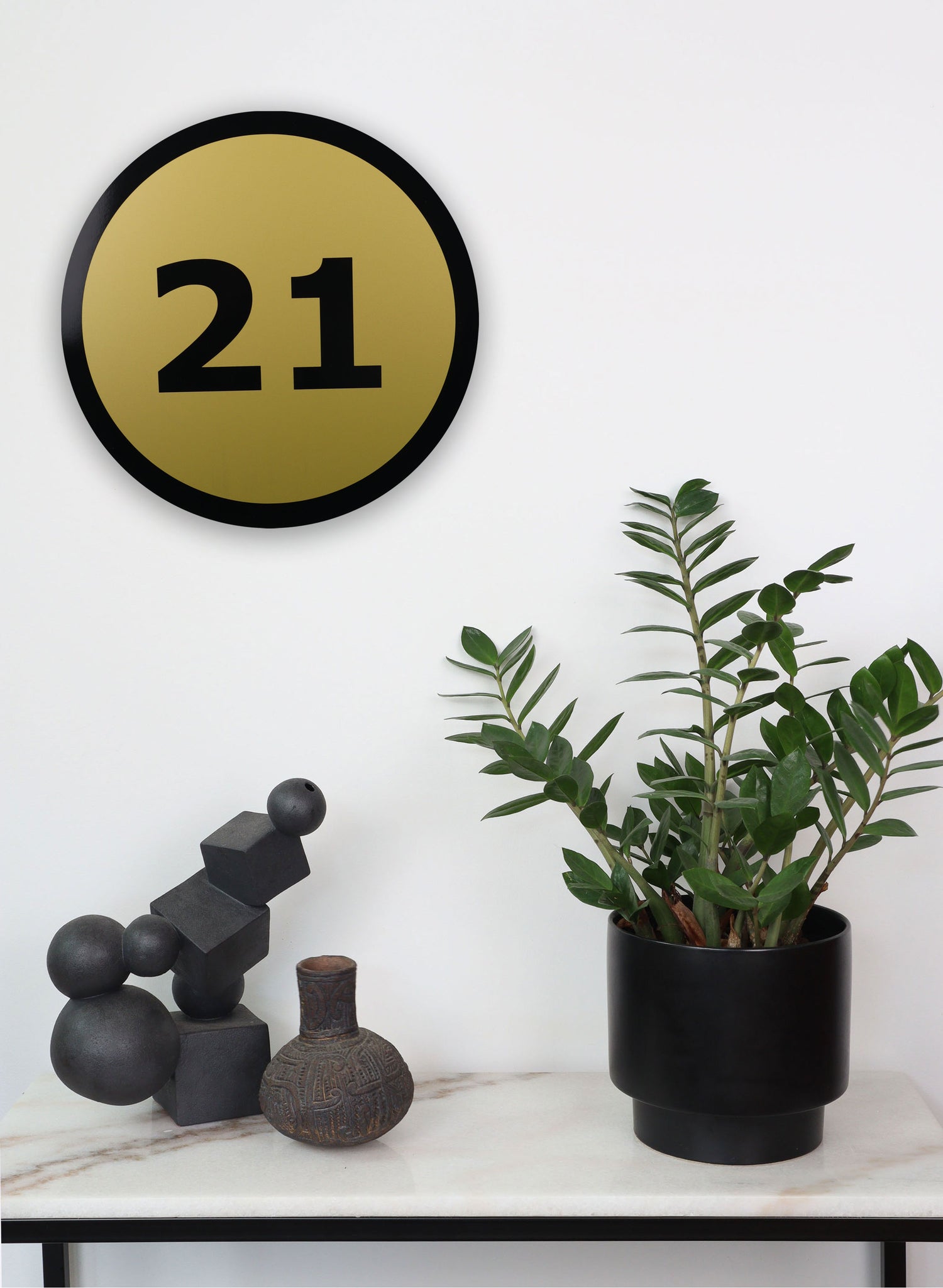 21 Round Black on Gold Sign