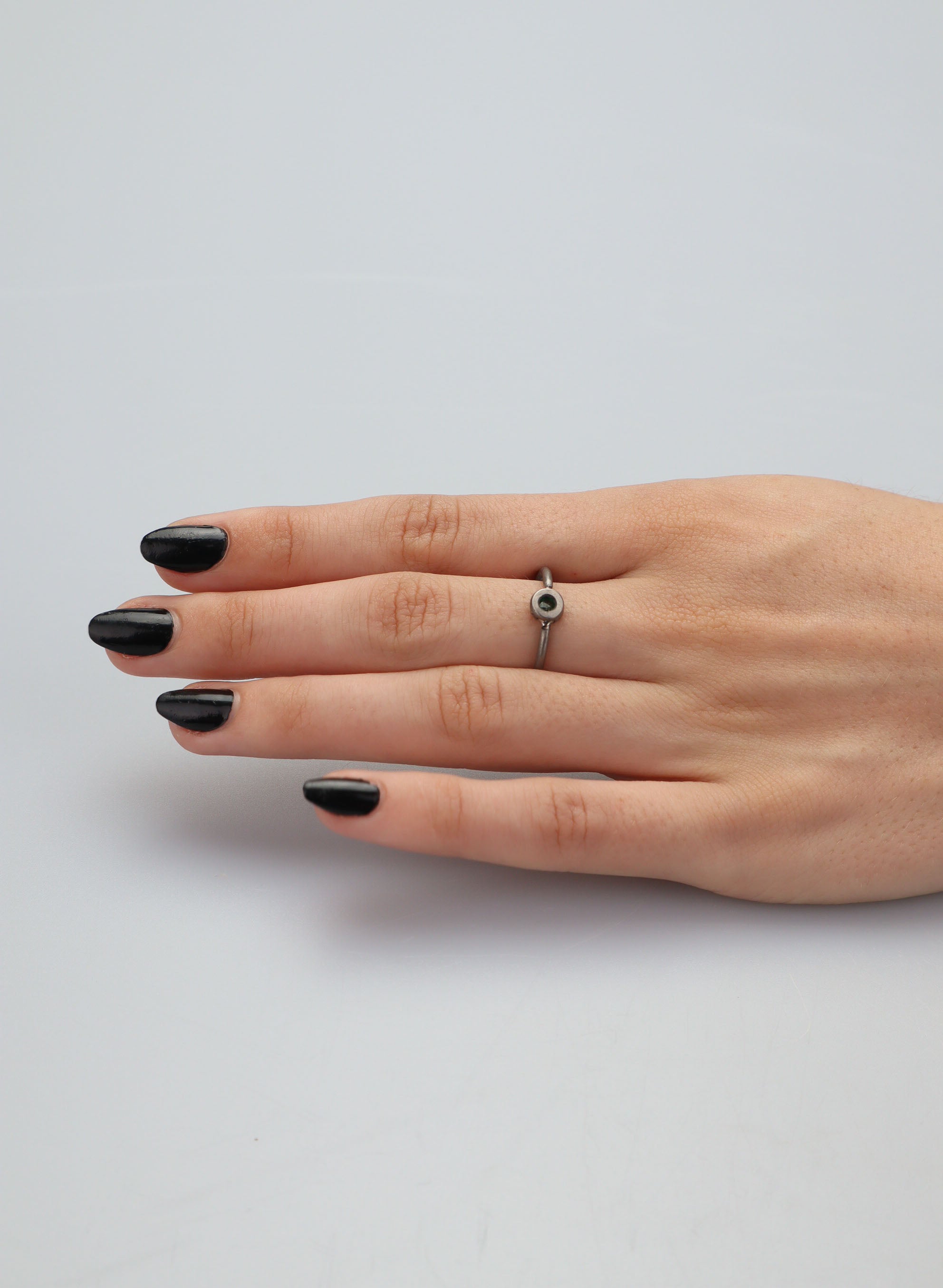 Faceted Untreated Emerald Titanium Ring