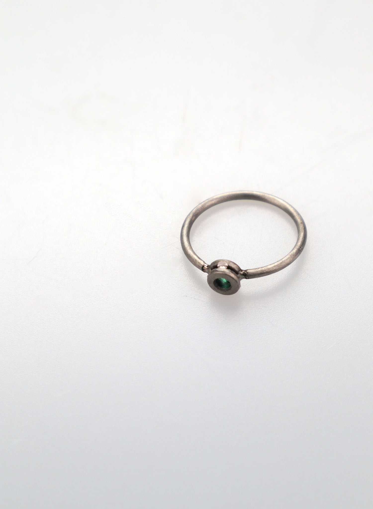 Faceted Untreated Emerald Titanium Ring