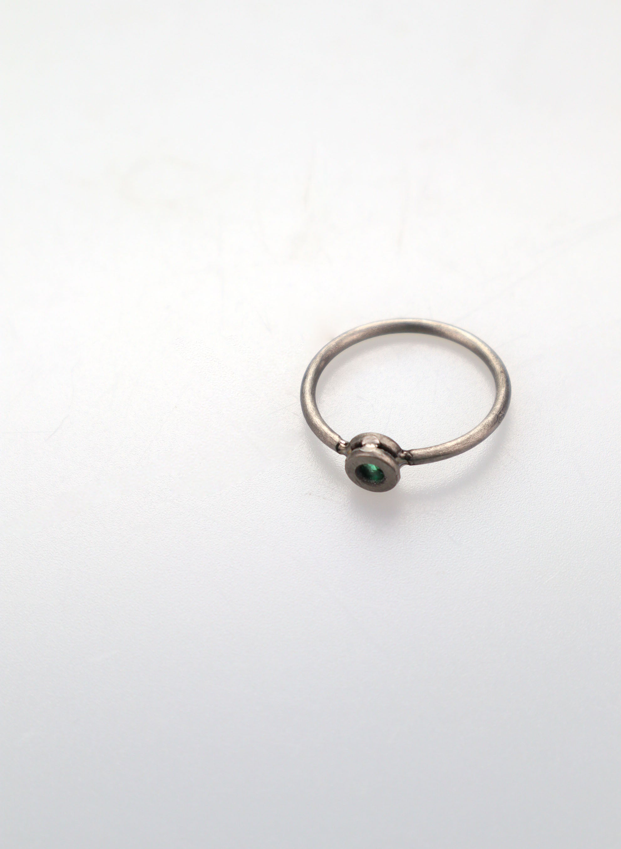 Faceted Untreated Emerald Titanium Ring