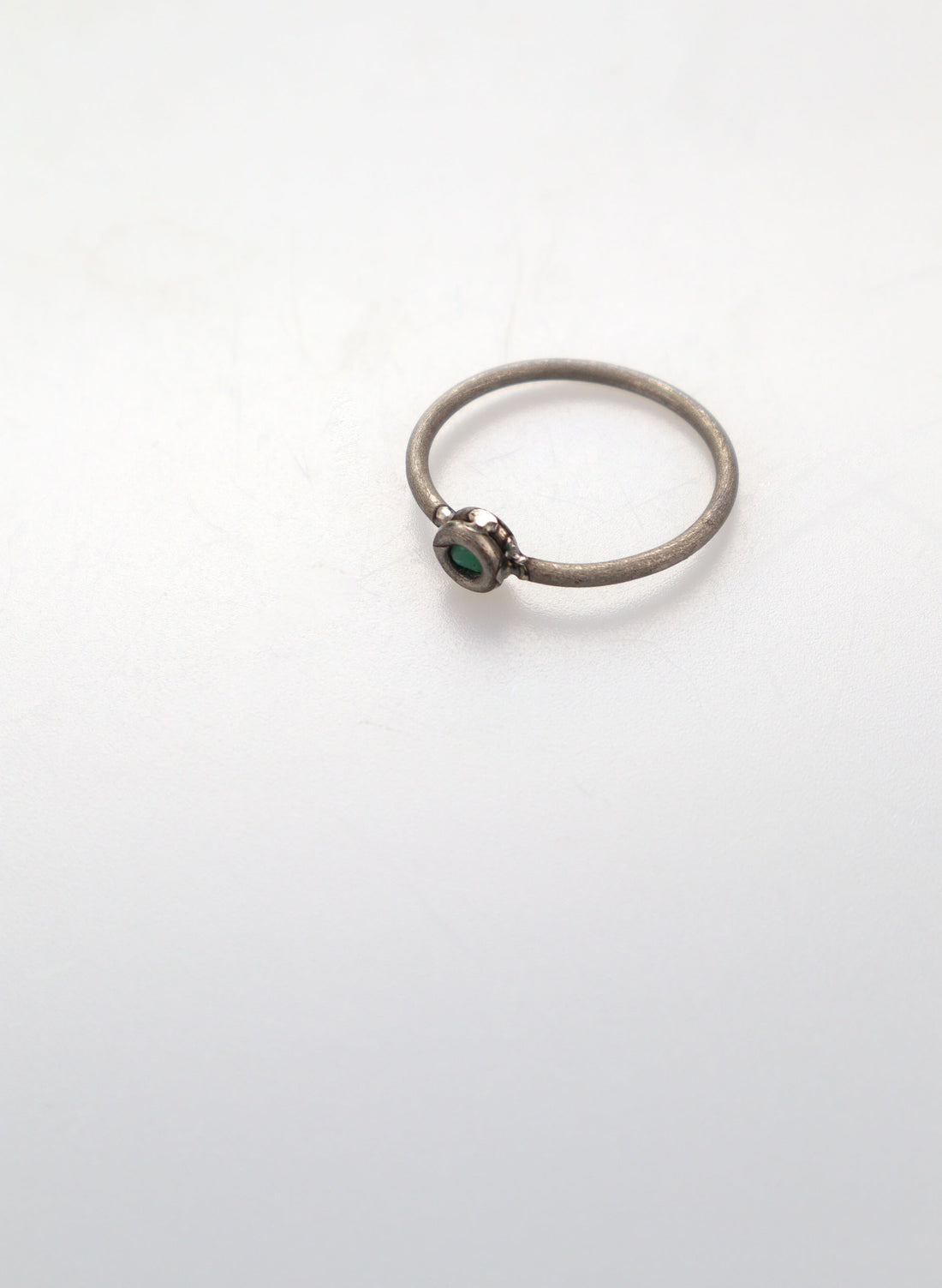 Faceted Untreated Emerald Titanium Ring