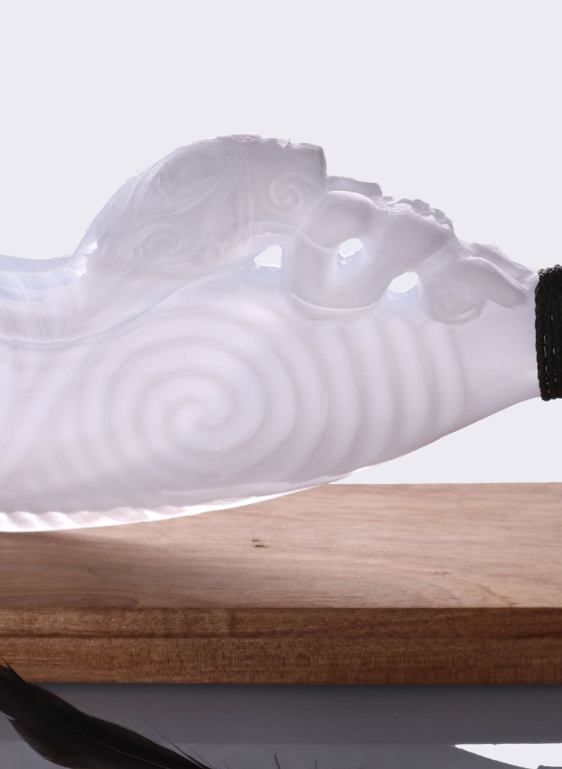 White and Clear Lead Crystal Glass Wahaika with a Pūkaiora(figure) on an Oak base