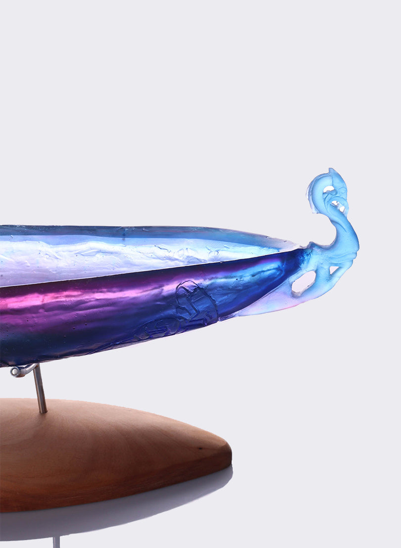 Blue Lead Crystal Glass Ipu with 2 Pūkaiora(figure) on an Oak base.
